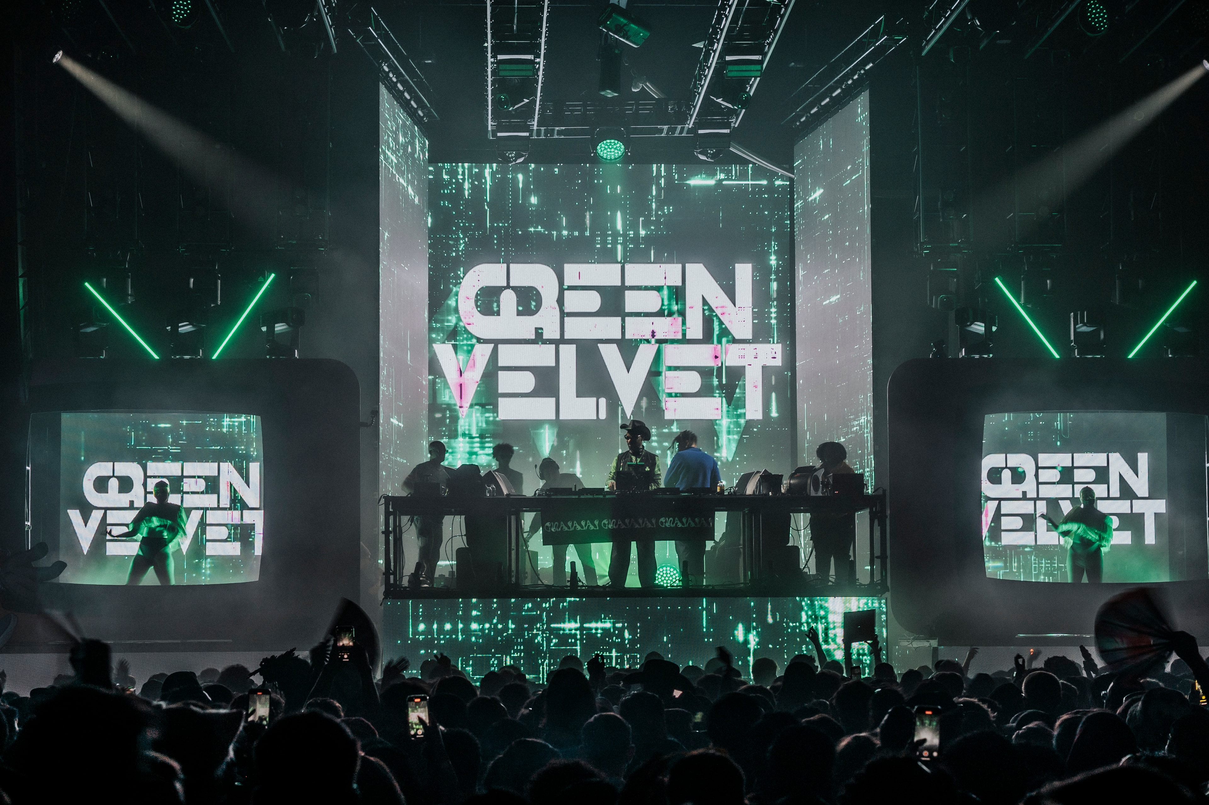 Green Velvet performing on the La La Land stage — neon green lighting and branded LED walls